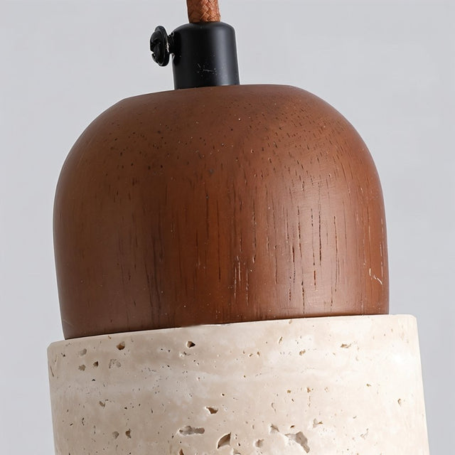 "Close-up of a travertine Gilto pendant light showing the wooden top and stone texture."