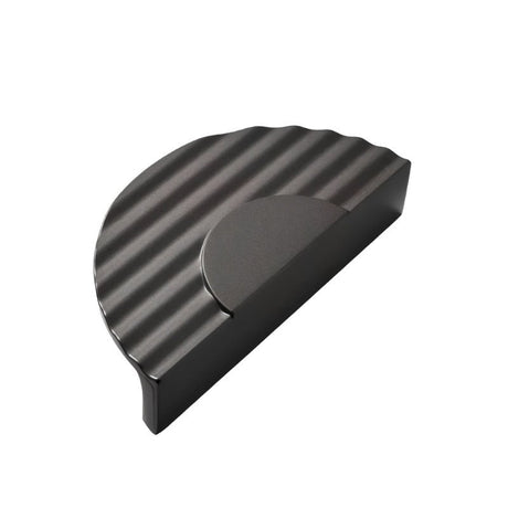"Black semi-circular drawer pull with ridged texture, made of zinc alloy."