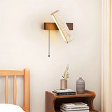 "A modern wall lamp with an angled yellow travertine shade and a rectangular wooden base, casting a warm, ambient light in a bedroom setting."