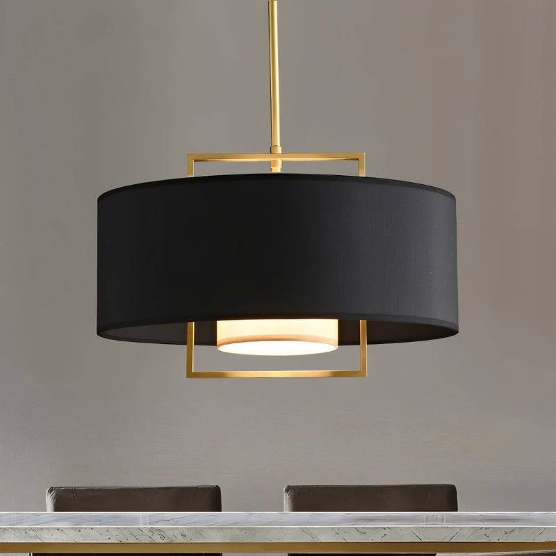 "Close-up of a black pendant light with a gold frame and a white diffuser."