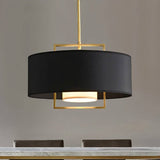 "Close-up of a black pendant light with a gold frame and a white diffuser."