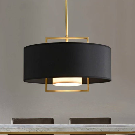"Close-up of a black pendant light with a gold frame and a white diffuser."