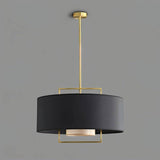 "A black pendant light with a gold frame, isolated on a grey background."
