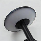 "Close-up of the diffuser of a modern, circular outdoor wall lamp, showing its sleek design."
