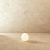 Glowing white sphere outdoor lights lining a stone pathway leading to a modern white pavilion at dusk in a garden setting.