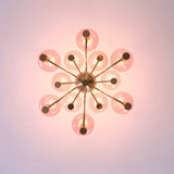Top view of Gloral Chandelier showing symmetrical pink glass globes and gold arms, ideal for modern indoor lighting design.