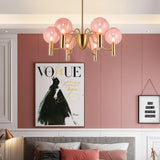 Gloral Chandelier installed in a pink-themed bedroom, offering elegant ambient lighting with pink glass and gold metal design.