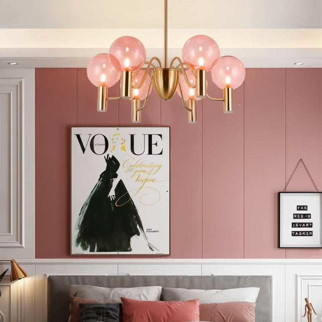 Gloral Chandelier installed in a pink-themed bedroom, offering elegant ambient lighting with pink glass and gold metal design.