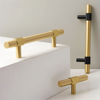 "Modern brass pull bar handles and knobs with brushed gold and black finishes on display."