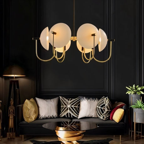 "Modern gold six-light chandelier with frosted glass orbs in a living room."