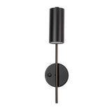 "A minimalist industrial black bedside reading lamp with a cylindrical shade and adjustable arm, featuring a visible on/off switch on the wall mount, isolated on a white background."