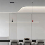 "Modern minimalist pendant light with linear design and red accents."