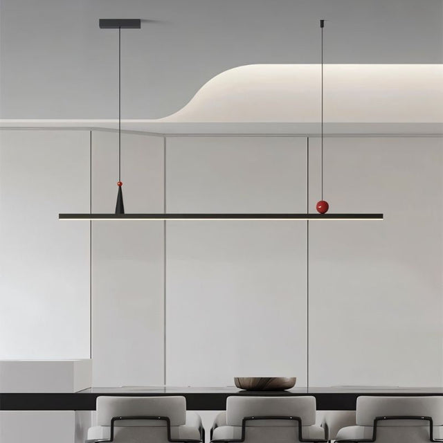 "Modern minimalist pendant light with linear design and red accents."