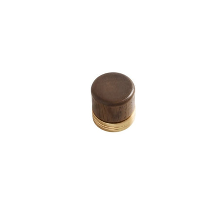 "Close-up of a modern knob featuring a wooden top and a golden metallic base."