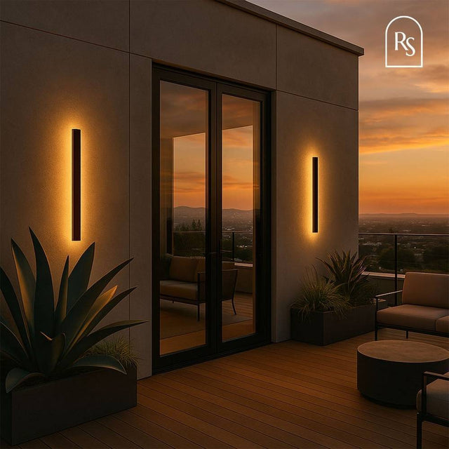Helios LED Outdoor Wall Lamps installed on a modern patio, providing warm ambient lighting for evening relaxation.
