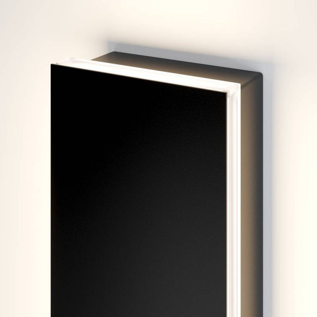 Top view of Helios LED wall light shows integrated LED and minimalist black housing for durable outdoor lighting.