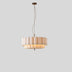 Hetis Pendant Light with a soft beige finish, featuring multiple layers, mounted against a plain white studio background.