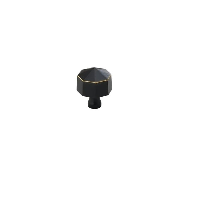 "Black brass hexagonal knob, isolated on a white background."
