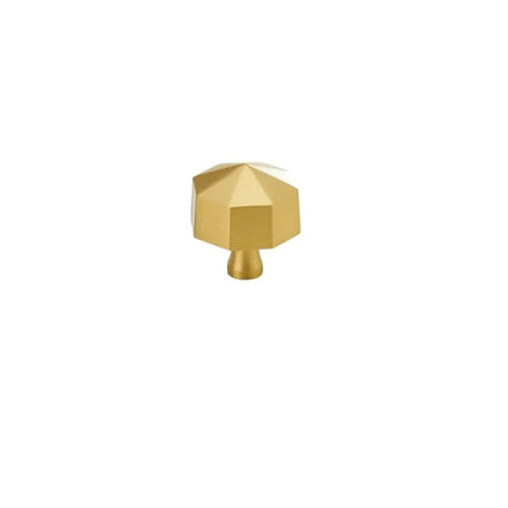 "Angled view of a gold brass hexagonal knob, isolated on a white background."