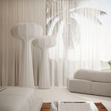 "Sculptural floor lamps with a modern minimalist design, placed in a contemporary living room setting with soft natural lighting, featuring a streamlined silhouette in high-quality material."