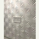 Close-up of Hite PVC Wall Panels with raised geometric pattern and integrated switch panel. Ideal for waterproof and durable wall finishes.