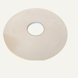 Close-up of adhesive tape roll used for mounting Hite PVC Wall Panels. Provides strong hold for easy and lasting wall installations.