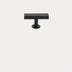 Black metal T-bar cabinet knob and pull with brushed gold accent on neutral background.