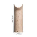 "Ilana travertine wall lamp, showcasing its curved design and compact dimensions (12.4"/31.5cm height, 3.7"/9.5cm depth)."
