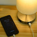 Ilka Table Lamp can charge smartphones while serving as modern lighting fixture