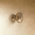 Crystal textured knob with pedestal base, shown against white background.