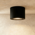 Cylindrical white ceiling light fixtures with adjustable gimbal design, shown front and side views with dimensions.