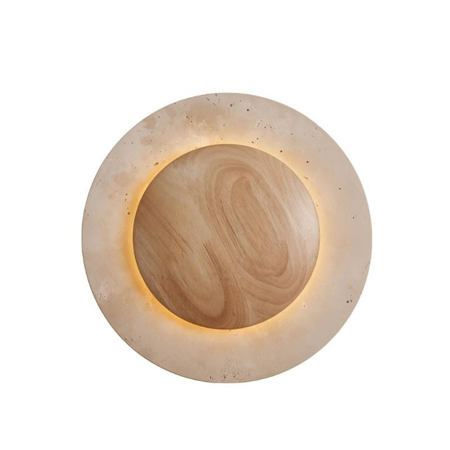 "Round wall lamp with a travertine stone outer ring and a textured wood center, softly illuminated from behind."