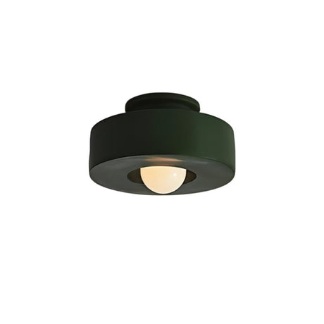 "Green circular flush mount ceiling light with recessed bulb."