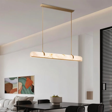 "Modern alabaster and copper linear chandelier providing soft, diffused light in a contemporary living room."