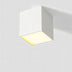 White square ceiling downlight with warm LED glow on neutral background.