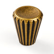 "A contemporary brass cone-shaped knob with sleek vertical grooves on the sides and a smooth, polished circular face."