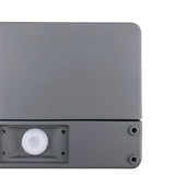 "Close-up of a minimalist rectangular outdoor wall lamp made of aluminum with a PC diffuser."