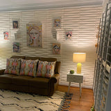 Kerso Wall Panel used in a cozy living room setup, featuring 3D wave patterns that add depth and artistic flair to the interior.