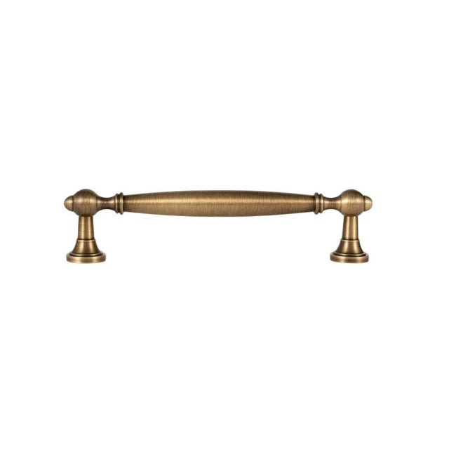 "An antique brass pull bar with a classic, elegant design, isolated on a white background."