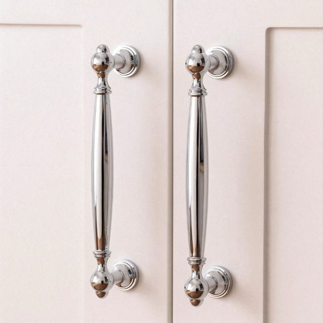 "Polished chrome brass pull bars on cabinet doors, showcasing an elegant, timeless design for luxury interiors."