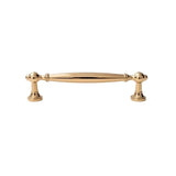 "A polished gold brass pull bar with a classic, elegant design, isolated on a white background."