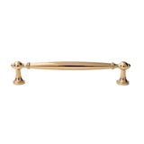 "A luxury polished gold brass pull bar with an elegant, timeless design, isolated on a white background."