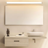 "Modern wall lamp with a white diffuser above a rectangular bathroom mirror and a contemporary vanity setup."