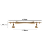 "Brass pull bar handle with a tapered spindle design and intricate finials, suitable for classic or transitional interiors."