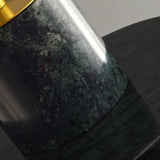 "Close-up of the green marble detailing on a modern pendant light, showcasing the texture and veining."