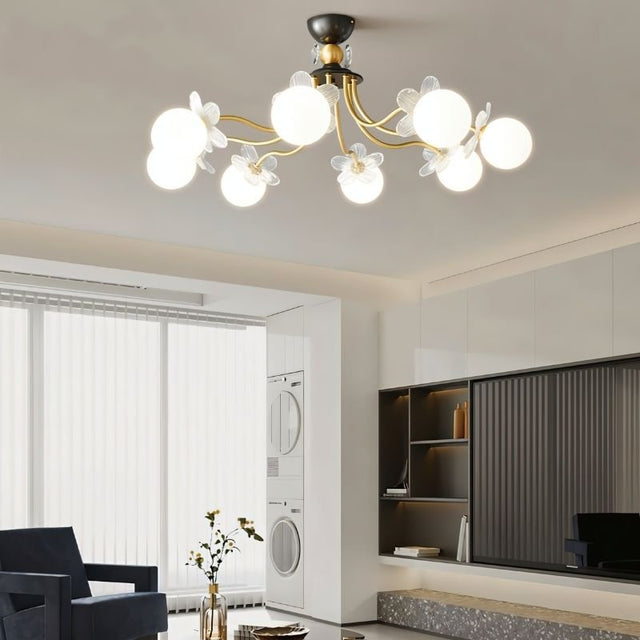 "Multi-light ceiling fixture with glass globes and petal details illuminating a modern living room."
