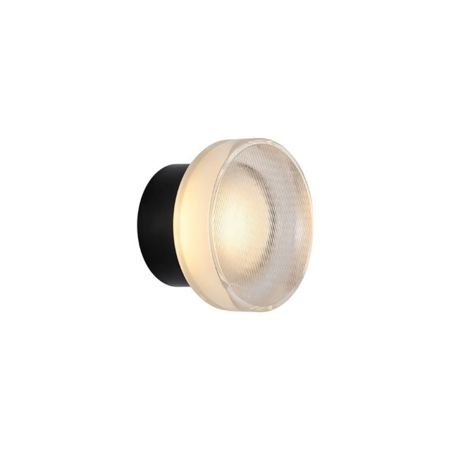 "A modern, minimalist wall lamp with a circular glass diffuser and a sleek black frame, emitting a soft, ambient glow."