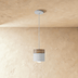 Cylindrical pendant light with frosted glass shade, brushed nickel hardware, shown against white background, front view with