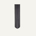 Vertical wall panel with dark gray ribbed texture on neutral background.