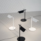 "Minimalist black and white table lamps with adjustable shades, crafted from metal for contemporary interiors"